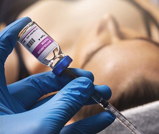 a doctor preparing a BOTOX injection