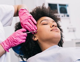 a patient undergoing BOTOX treatment from her dentist